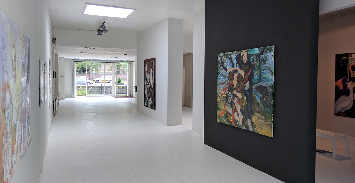 Installation view at Hoorn & Reniers, with paintings on a black feature wall